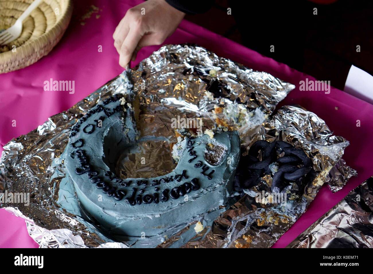A partially-eaten Fifty Shades of Grey cake at the 2014 Edible Book Festival, a literary cake competition for students on the Homewood campus of the Johns Hopkins University in Baltimore, Maryland, 2014. Courtesy Eric Chen. Stock Photo