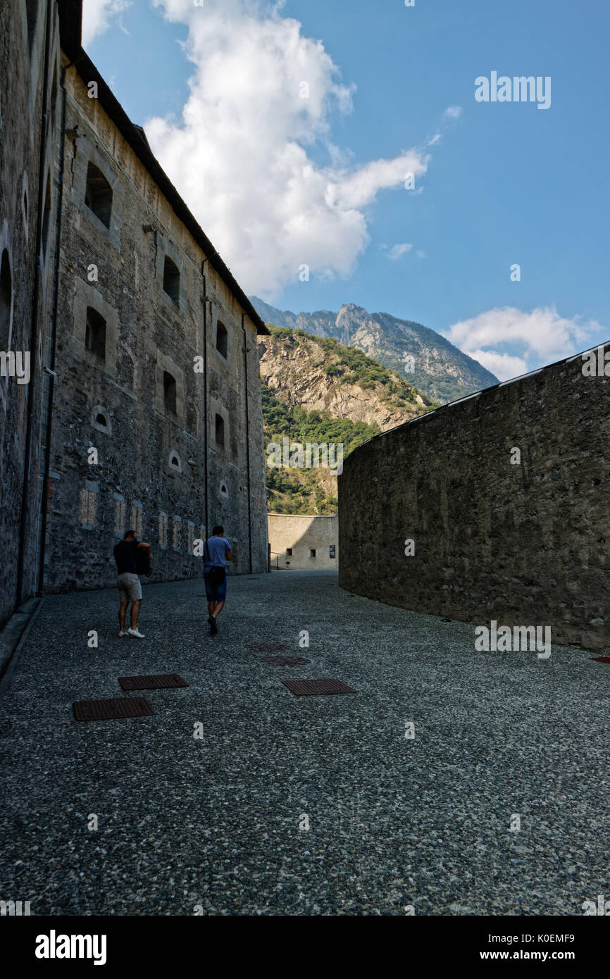 Fort Bard, Valle d'Aosta, Italy - August 18, 2017: Historic military construction defence Fort Bard. Touristic medieval fortress in Italian Alps. Loca Stock Photo