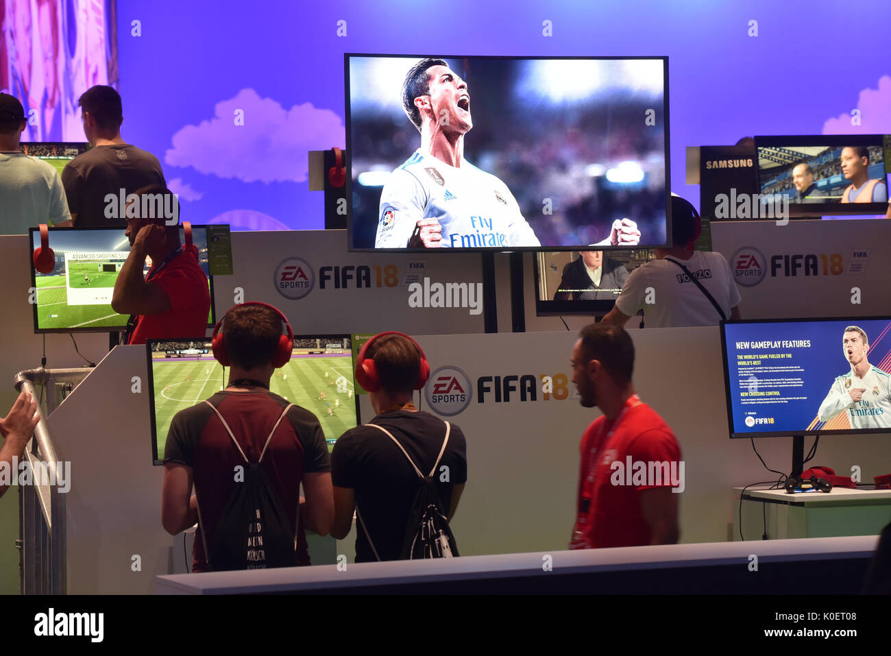 Cologne, Germany. 22nd Aug, 2017. Germany, Cologne, August 22, 2017, Gamescom: Players at the booth of EA Sports mit FIFA 18. Credit: Juergen Schwarz/Alamy Live News Stock Photo