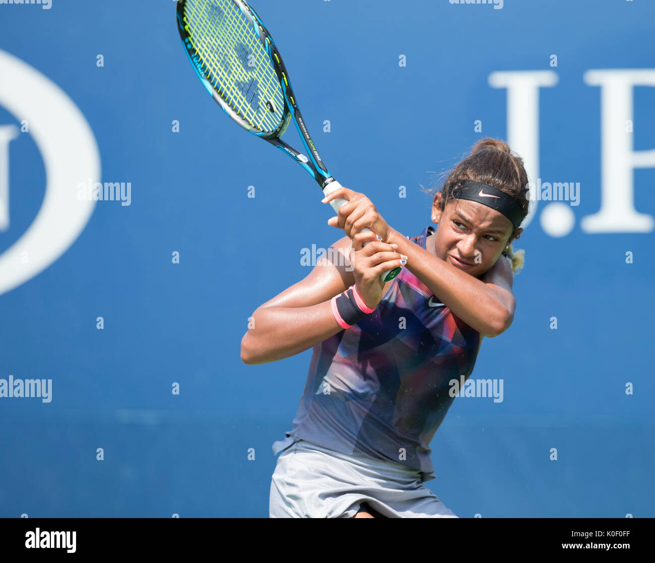 New York, USA. 22nd Aug, 2017. Whitney Osuigwe of USA returns ball during qualifying game against Anna Blinkova of Russia at US Open 2017 Credit: lev radin/Alamy Live News Stock Photo