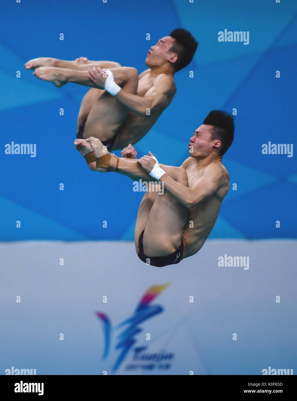 Tianjin. 23rd Aug, 2017. Chen Aisen of Guangdong and Yang Hao of Shaanxi compete during the men's 10m platform synchronised final of Diving at the 13th Chinese National Games in north China's Tianjin Municipality, Aug. 23, 2017. Chen Aisen and Yang Hao claimed title with 496.95 points. Credit: Li Xiang/Xinhua/Alamy Live News Stock Photo