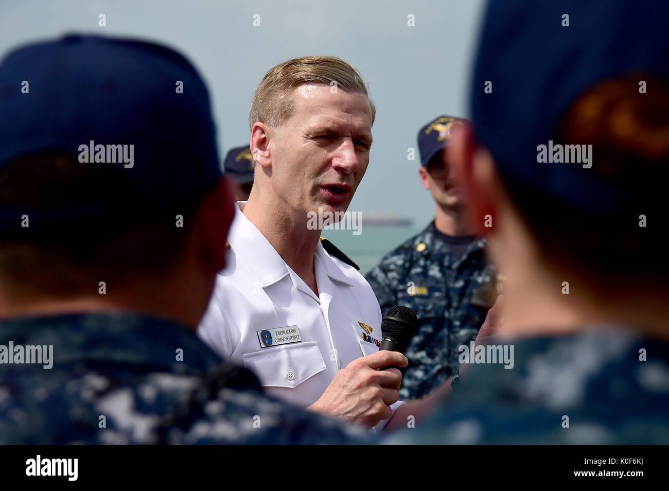 Singapore, Singapore. 23rd Aug, 2017. U.S. Navy Vice Adm. Joseph Aucoin, commander of 7th Fleet, talks with Sailors during an all hands call aboard USS Fort Worth February 17, 2016 in Singapore. Aucoin was relieved of duty as Commander of the U.S. 7th Fleet August 23, 2017 following a series of ship collisions resulting in the death of sailors under his command. Credit: Planetpix/Alamy Live News Stock Photo