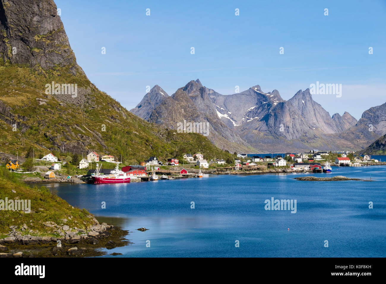 View across the natural fishing harbour to mountains. Reine, Moskenes, Moskenesøya Island, Lofoten Islands, Nordland, Norway, Scandinavia Stock Photo