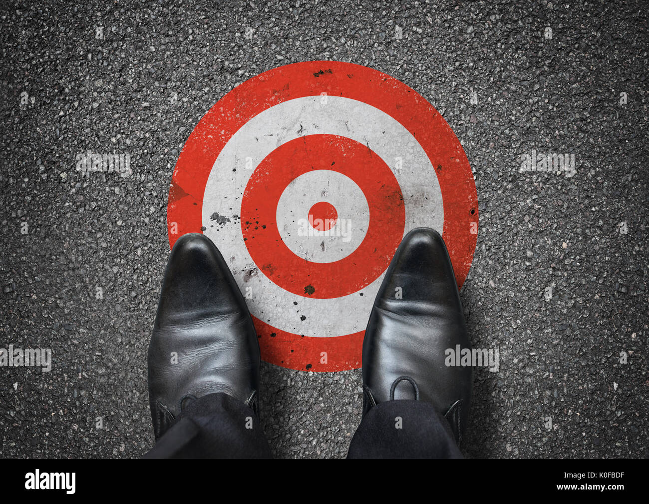A businessman looking down at a target. Business concept. Stock Photo
