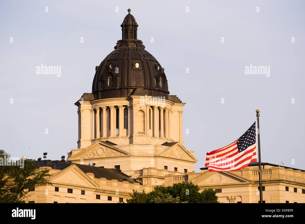 Sunrise lights up the capitol dome in Pierre, SD Stock Photo