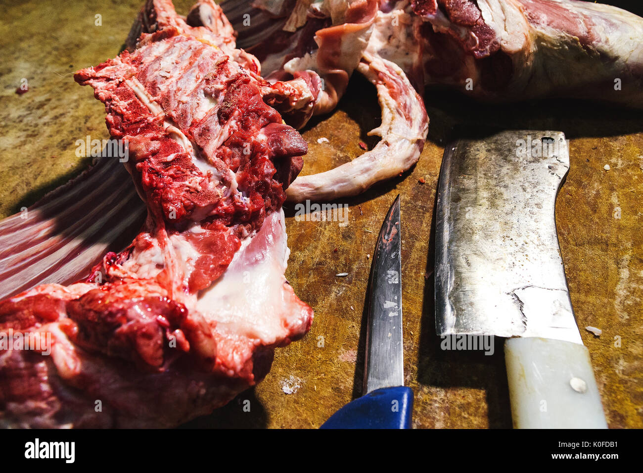 Butchers block with freshly sliced meat Stock Photo