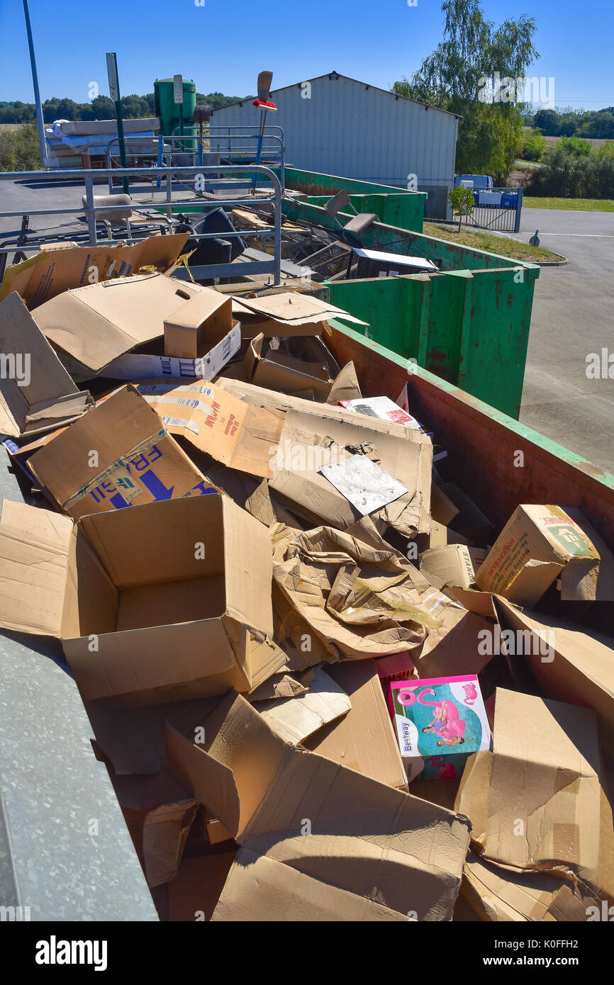 Cardboard boxes in public rubbish skip, France Stock Photo Alamy