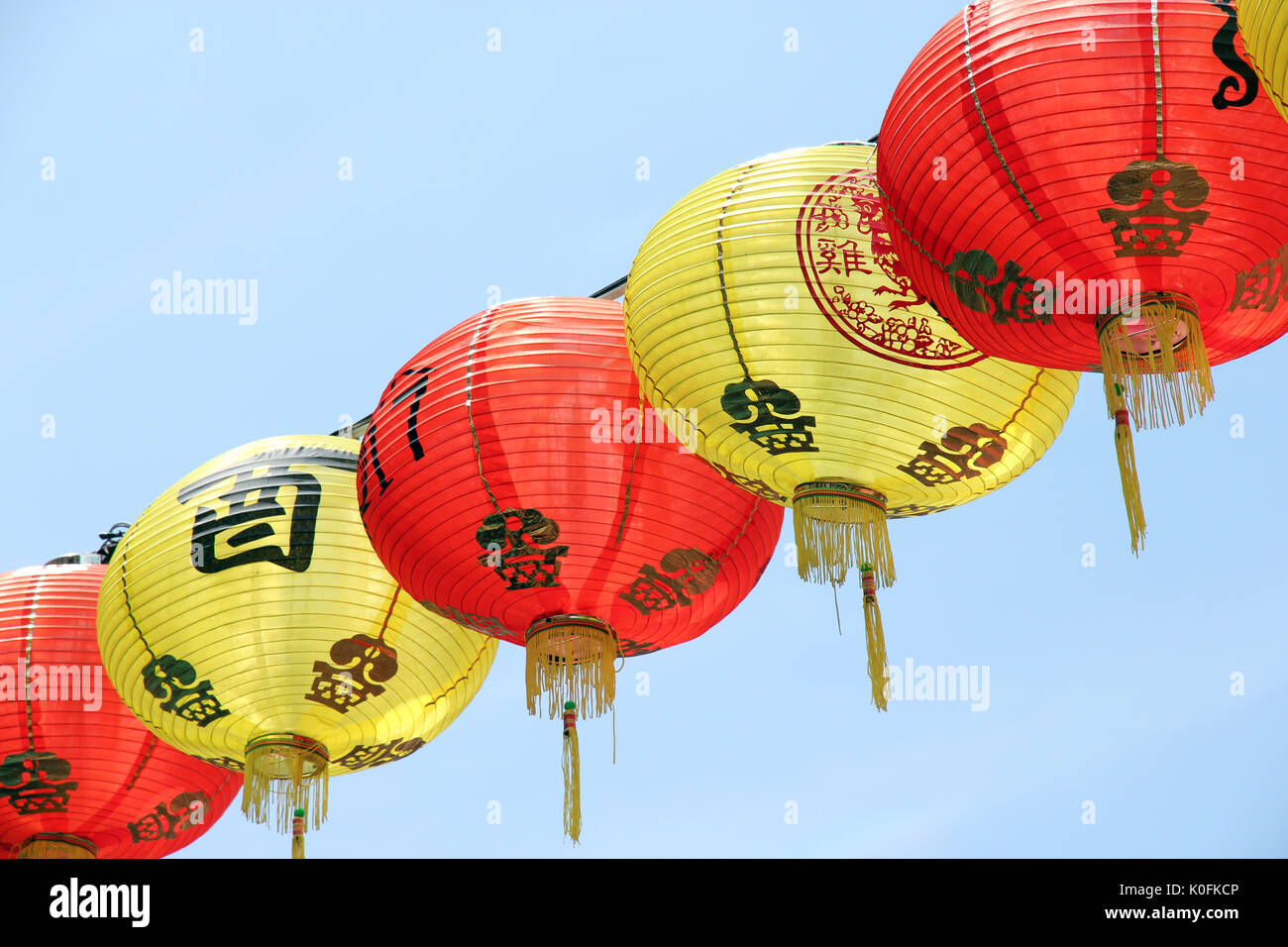 Chinese red lantern with gold stripes isolated on white background