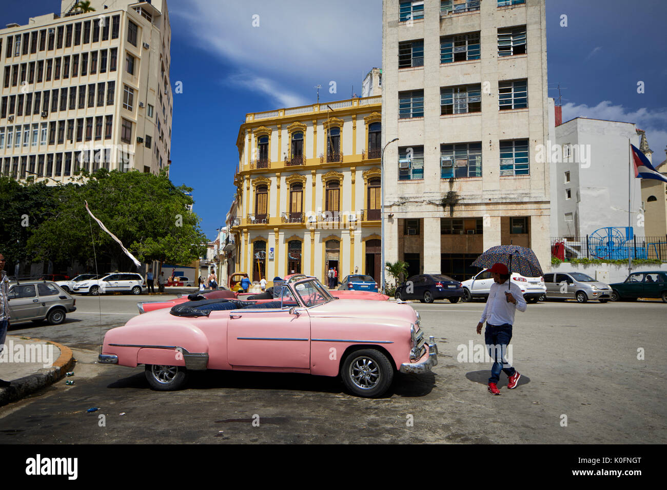 Cuban, Cuba, Capital, Havana Classic old American rerto taxi cars parked one being fixed with its boot up Stock Photo