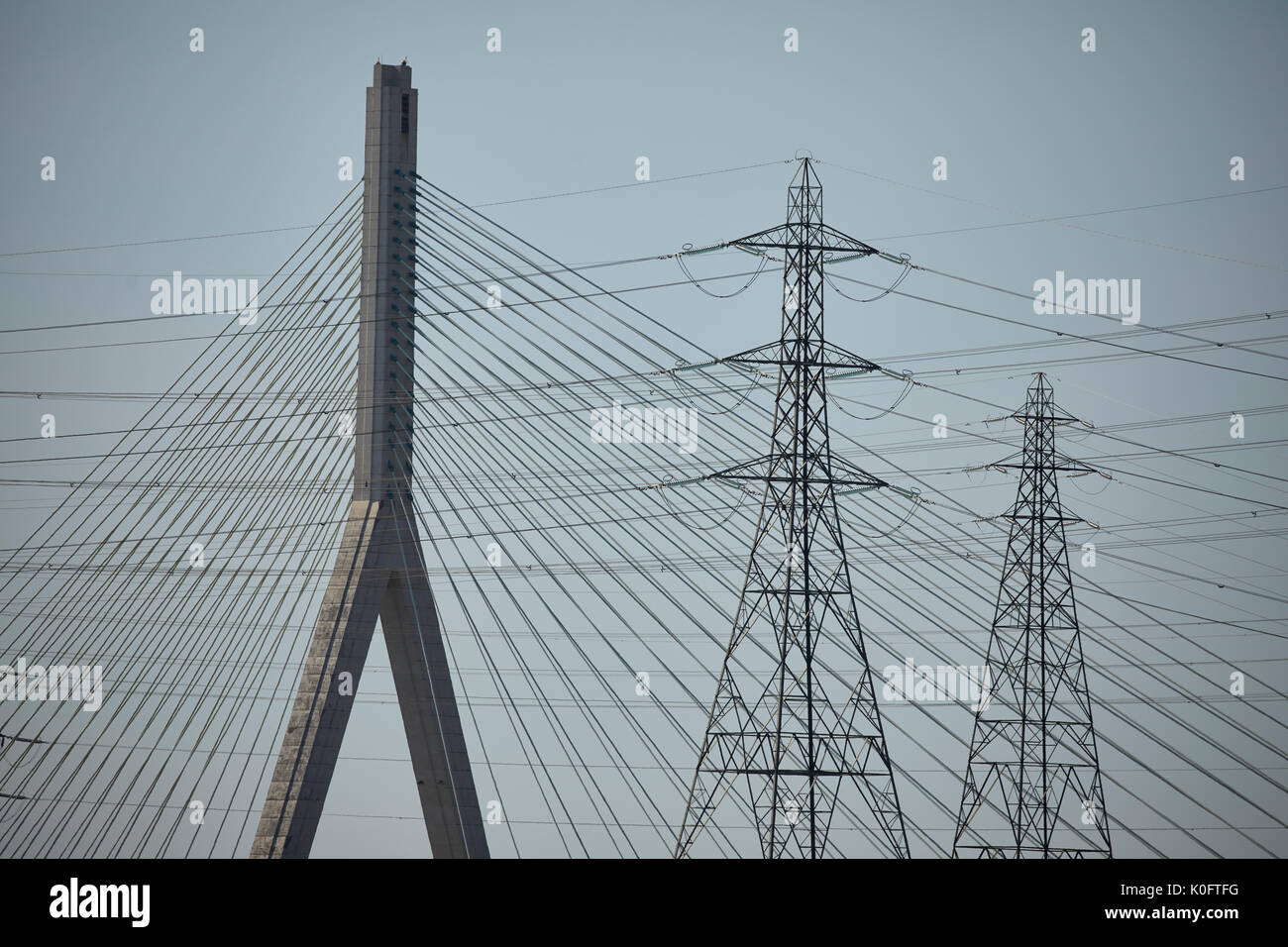 Pylons Flintshire in north Wales  south bank of the River Dee framed by Flintshire Bridge cable-stayed  spanning Dee Estuary Stock Photo