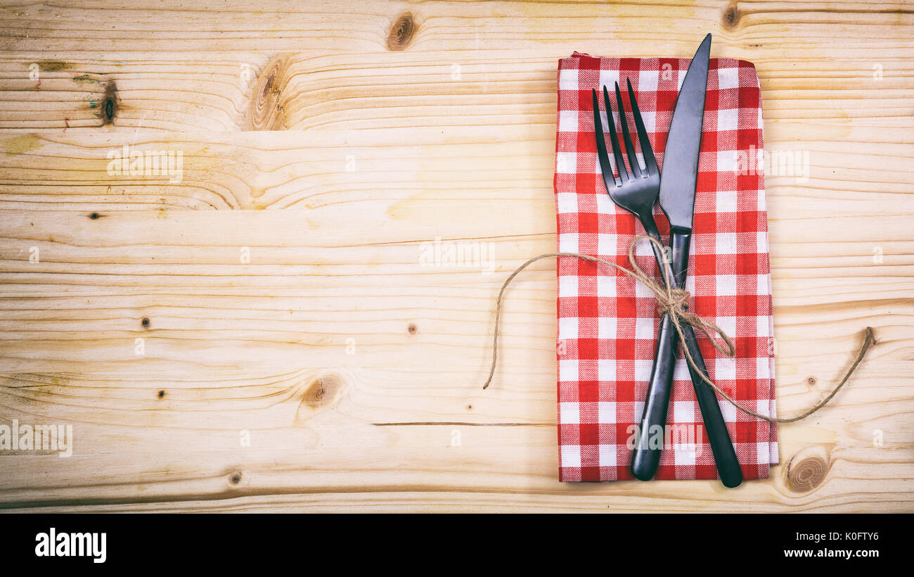 Table setting with fork and knife on wooden background Stock Photo - Alamy
