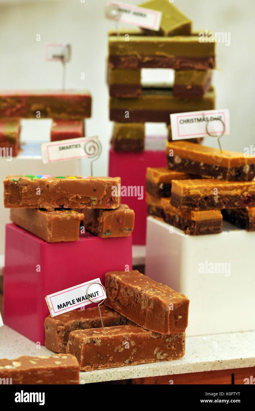 sticky sweets and fudge toffees for sale on a stall displayed for