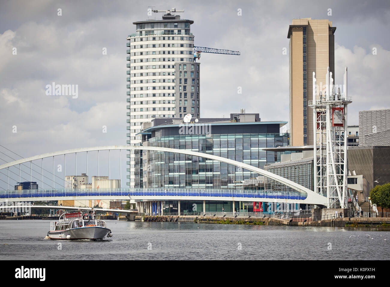 Manchester MediaCityUK,Salford Quays, Millennium Bridge and Manchester River Cruises dutch built 'Princess Katherine drives in central bay from the Sh Stock Photo