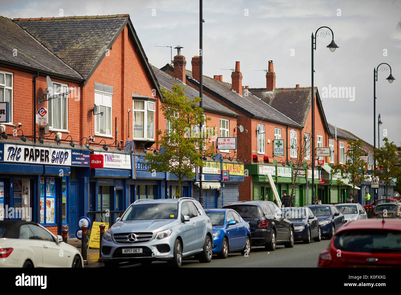 Platt Lane, a shopping parade of local shops in the Manchester suburb of  Fallowfield Stock Photo - Alamy