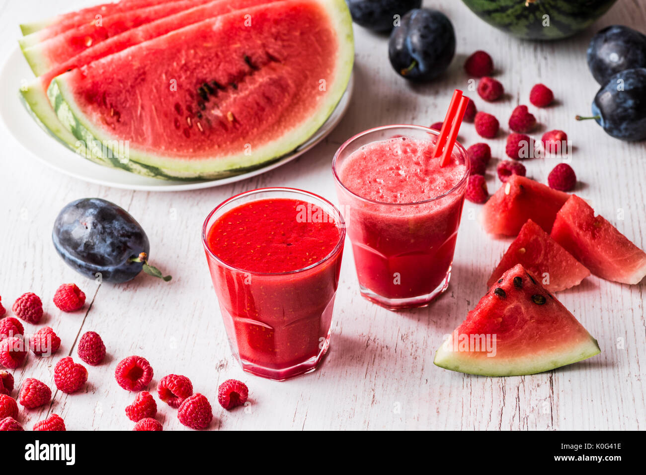 healthy drinks. watermelon and raspberry smoothies on white wooden ...