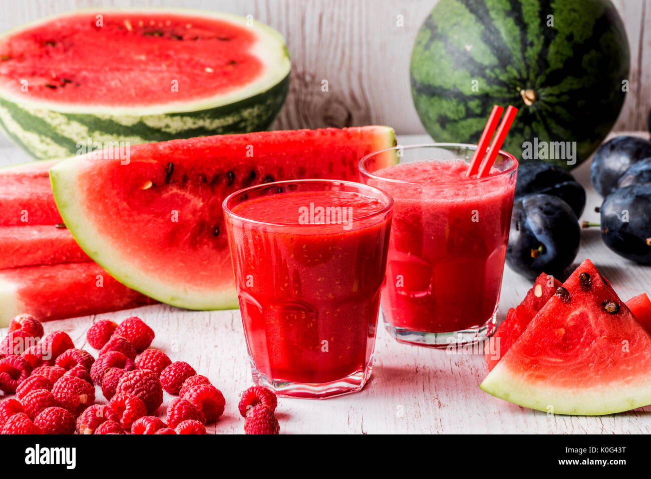 healthy drinks. watermelon and raspberry smoothies on white wooden ...