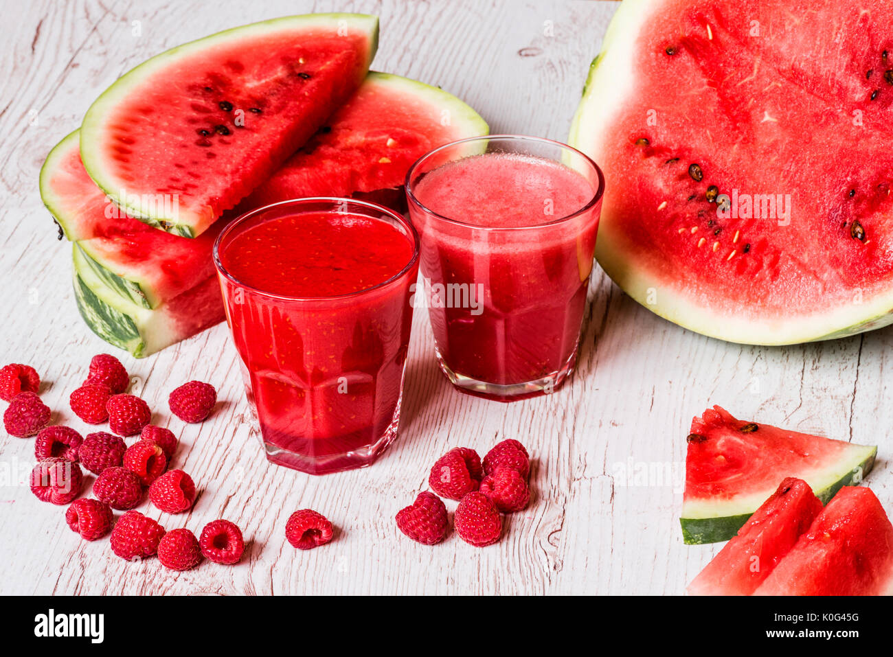 healthy drinks. watermelon and raspberry smoothies on white wooden ...