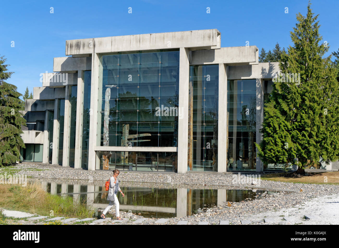 Woman walking in front of the UBC Museum of Anthropology building designed by Arthur Erickson, Vancouver, BC, Canada Stock Photo