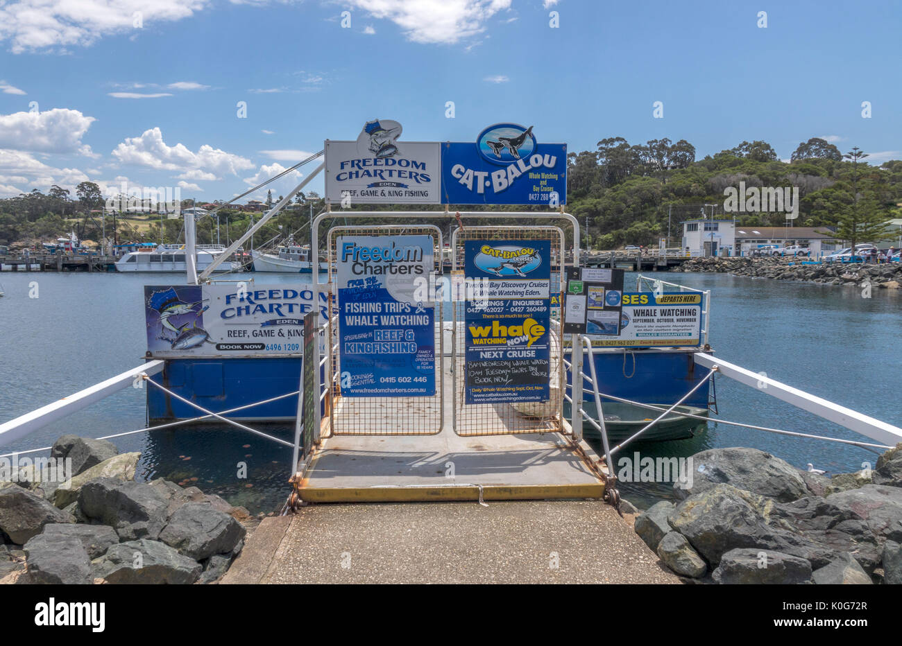 Freedom Charters And Cat Balou Fishing Charter And Whale Watching Private Pier Jetty In The Port Of Eden New South Wales Australia Stock Photo