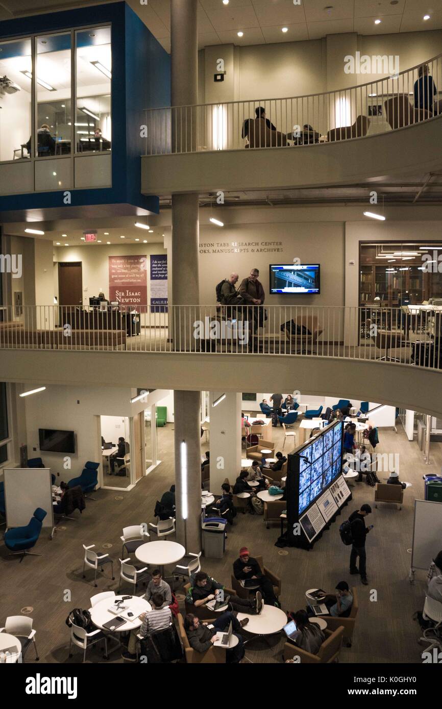 A view of three levels of the Brody Learning Commons, an interactive/collaborative study space and library, filled with college students studying, on the Homewood campus of the Johns Hopkins University in Baltimore, Maryland, 2014. Courtesy Eric Chen. Stock Photo