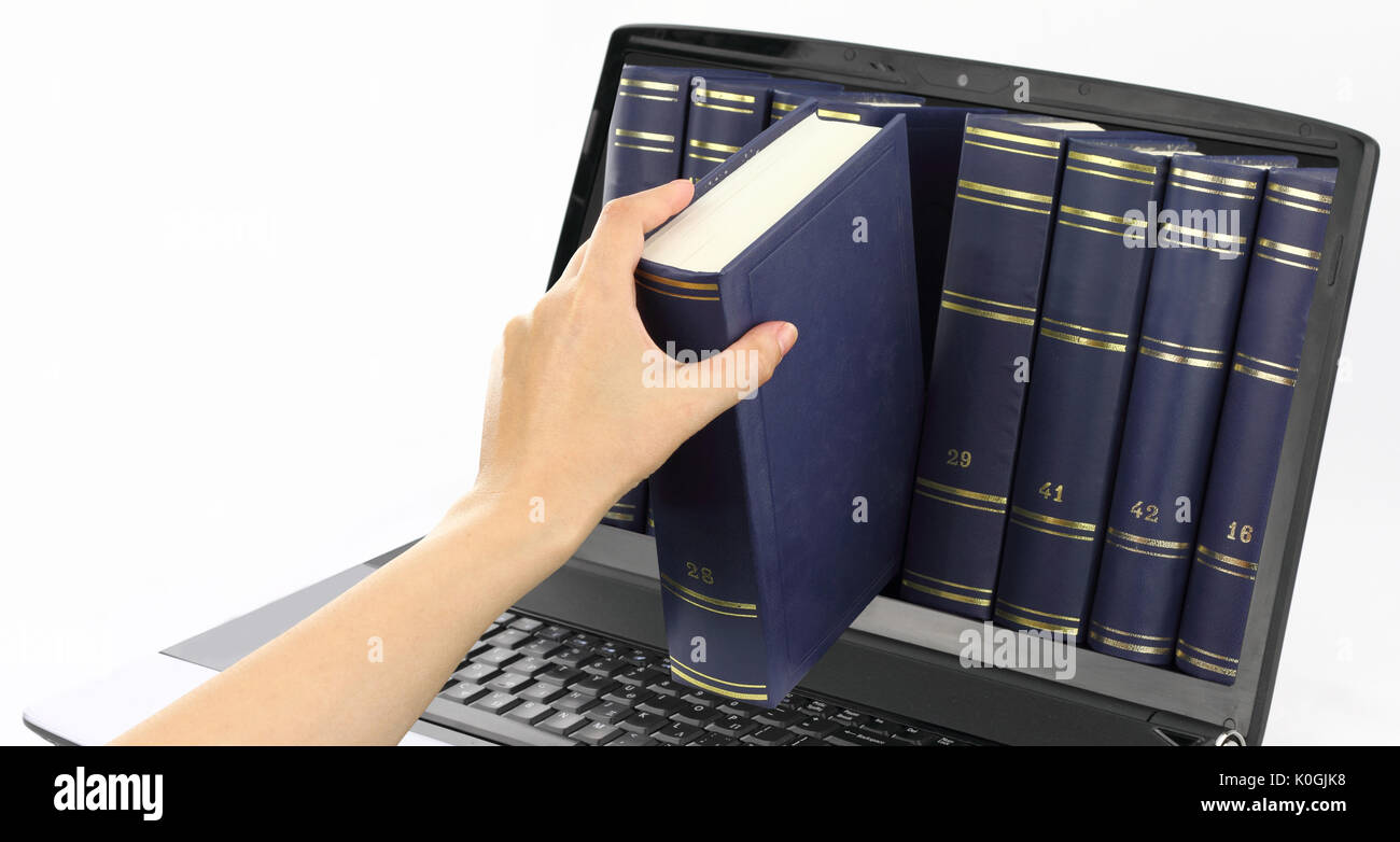 Laptop computer with books, isolated on white Stock Photo