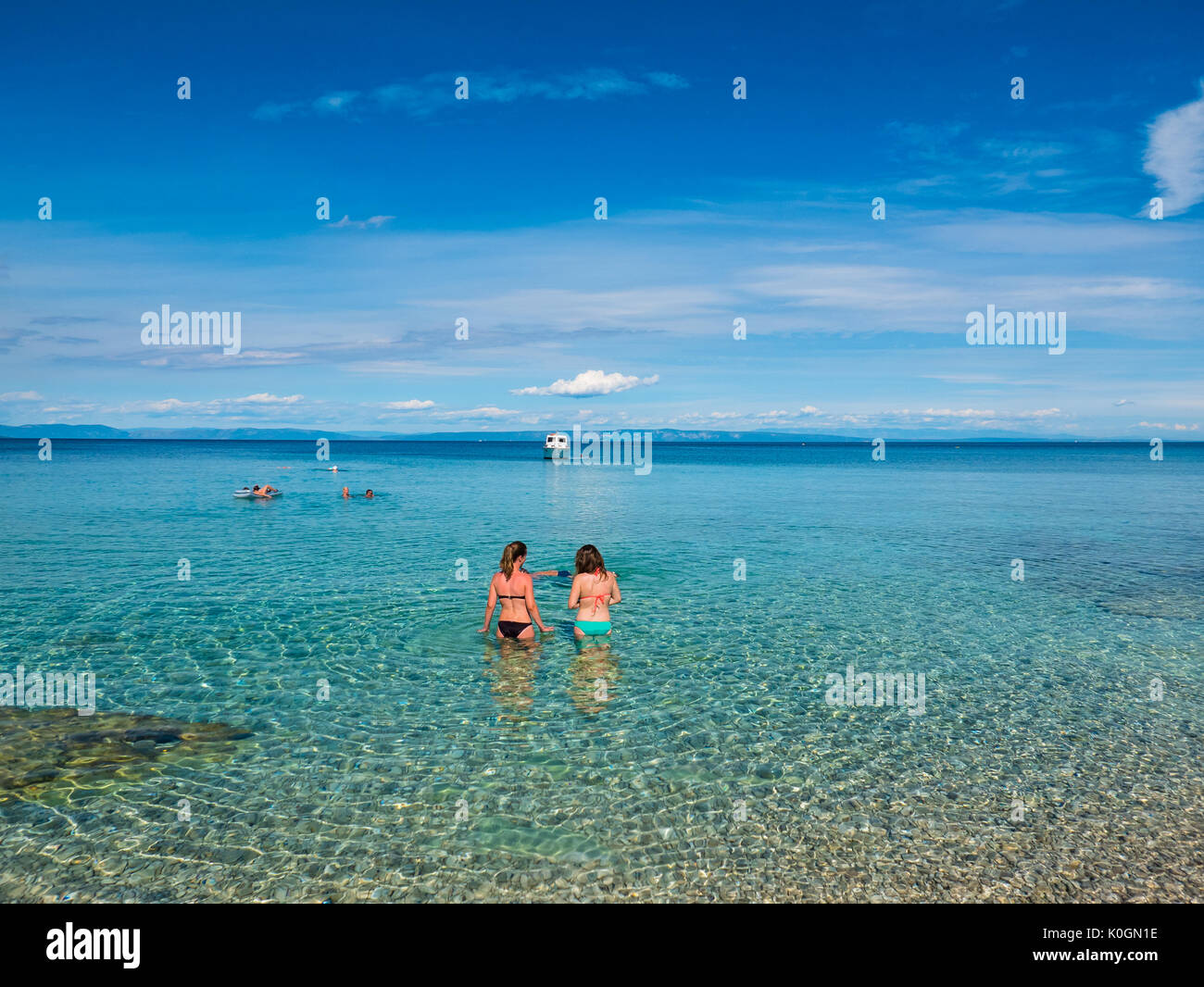 Istria, Croatia - 27 July 2017 - People enjoying a beautiful wild beach in Medulin Riviera in Istria, Croatia. Stock Photo