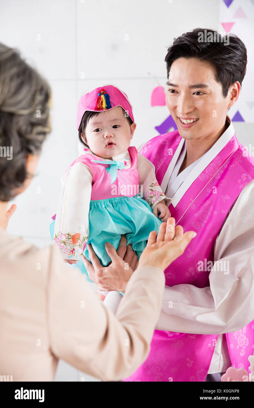 Smiling father and baby girl at first birthday party Stock Photo - Alamy