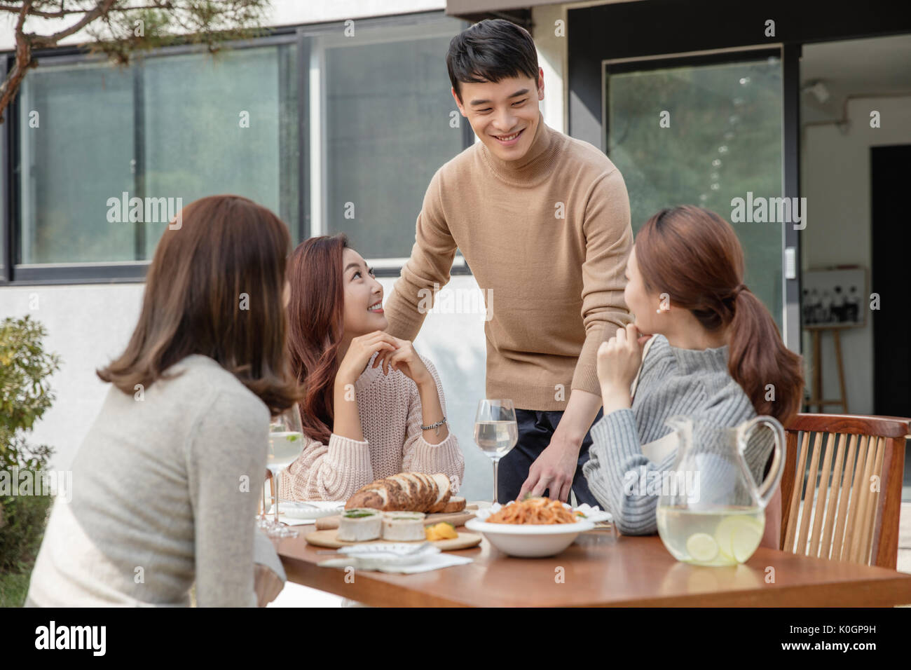 Smiling friends having party hi-res stock photography and images - Alamy