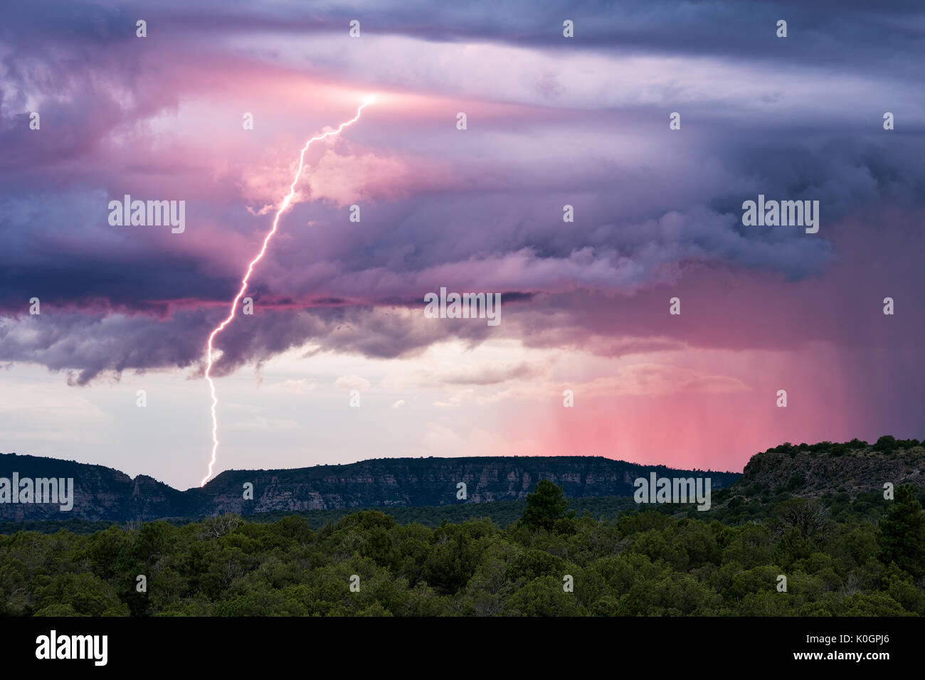 Sunset lightning and monsoon thunderstorm clouds over Sedona, Arizona Stock Photo