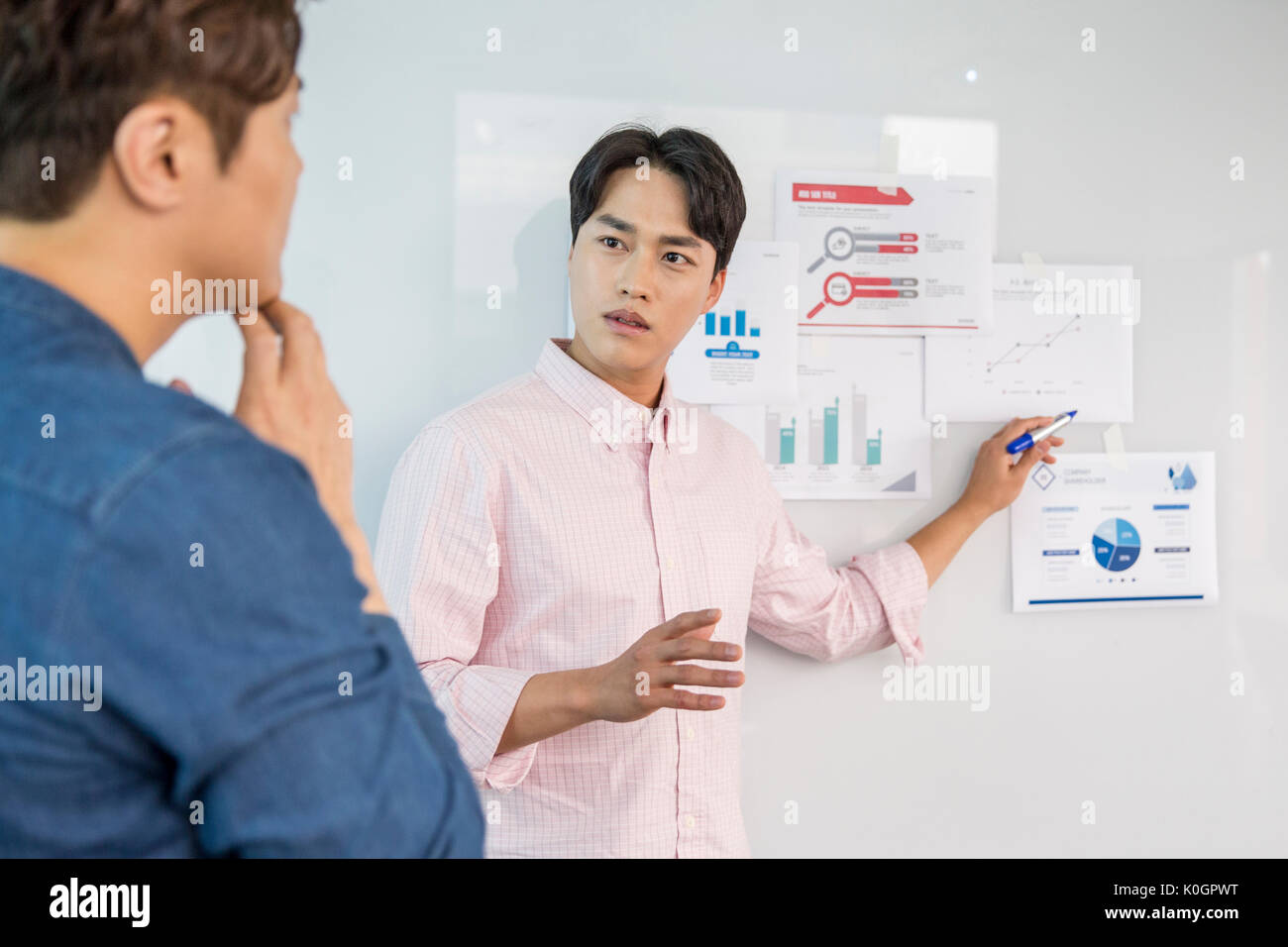 Two businessmen having a discussion about data Stock Photo