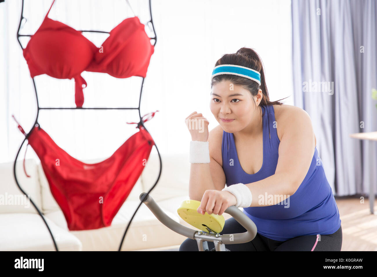 Young fat woman deciding to lose her weight Stock Photo