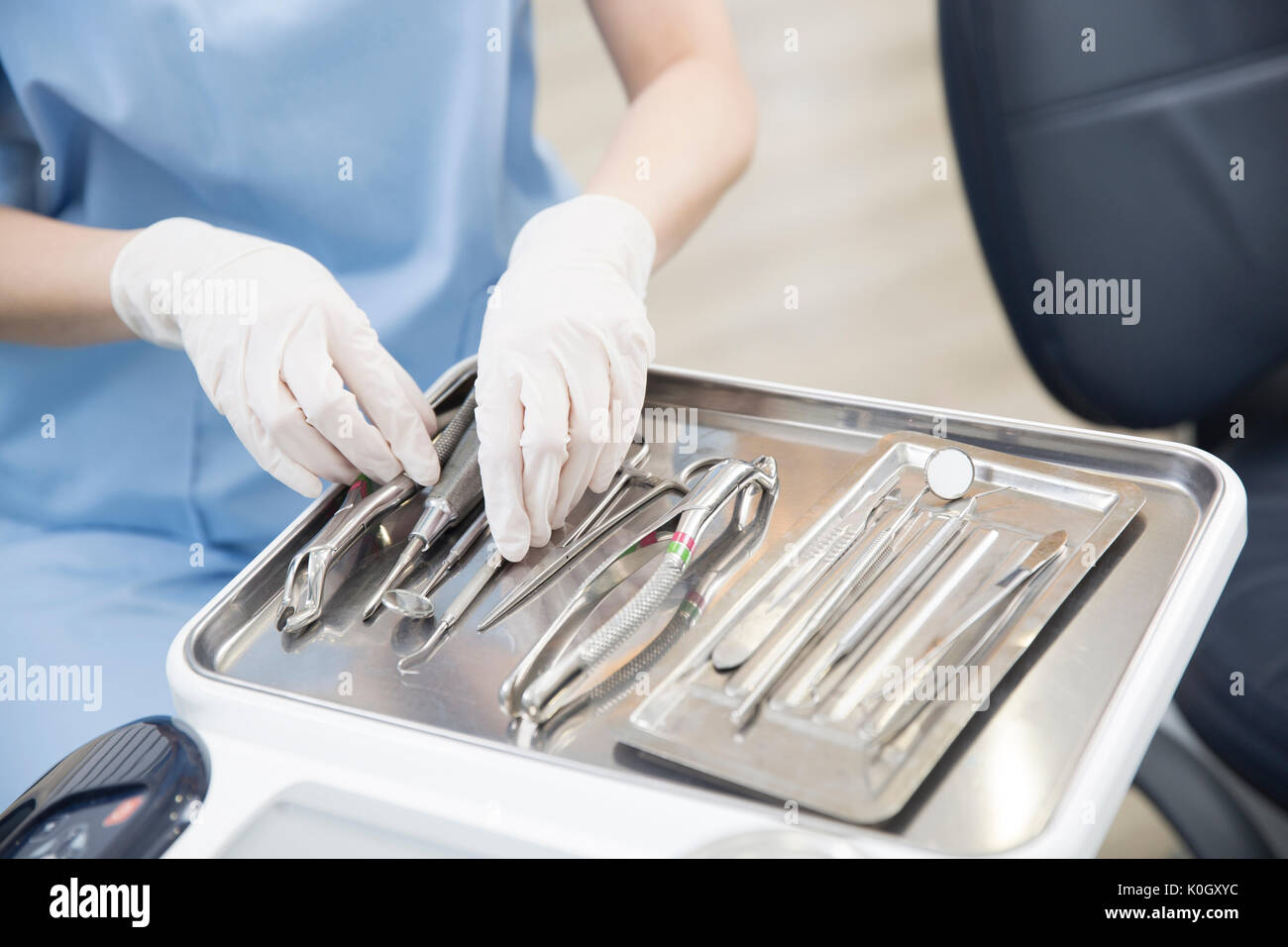 Dentist with various medical instruments at dental clinic Stock Photo Alamy