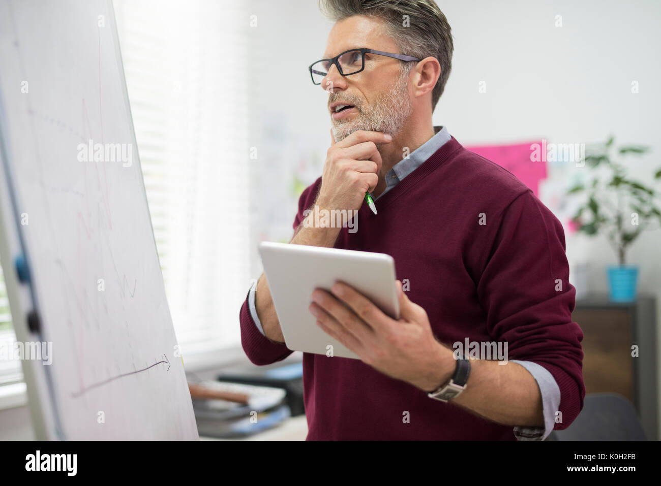 Hardworking man with digital tablet Stock Photo