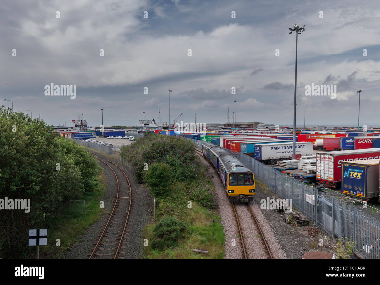 The once daily passenger train to Heysham port departs the port to Leeds formed of a Northern Rail pacer train Stock Photo