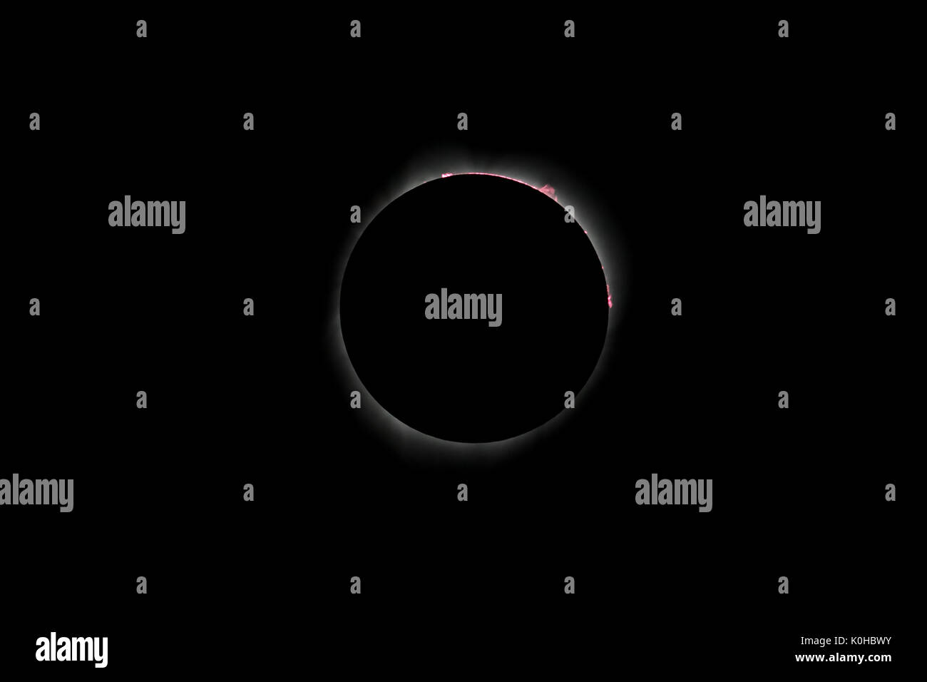 Total eclipse with corona ring showing prominence and flare Stock Photo