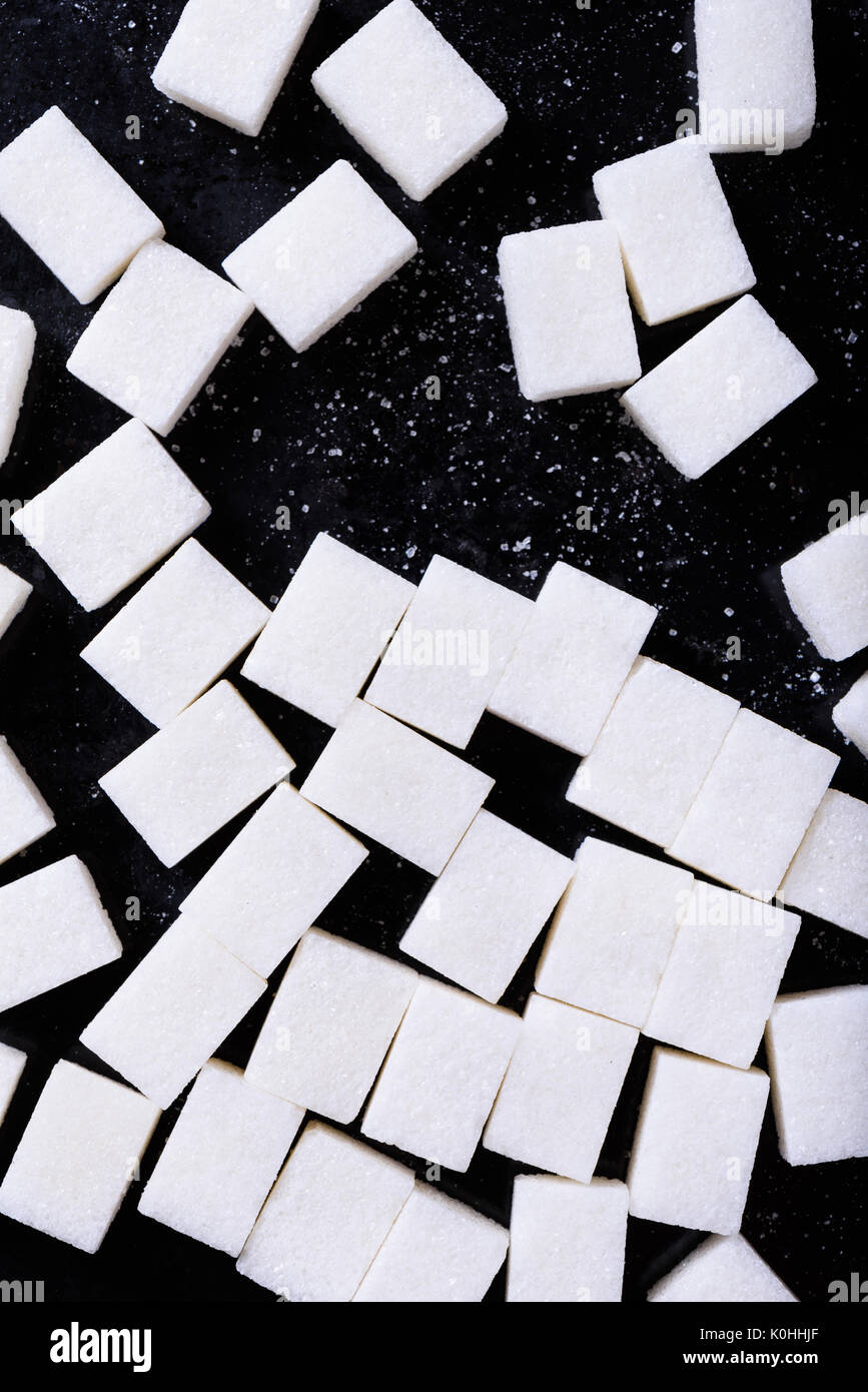 Background of sugar cubes. Cube sugar background. Above view Stock