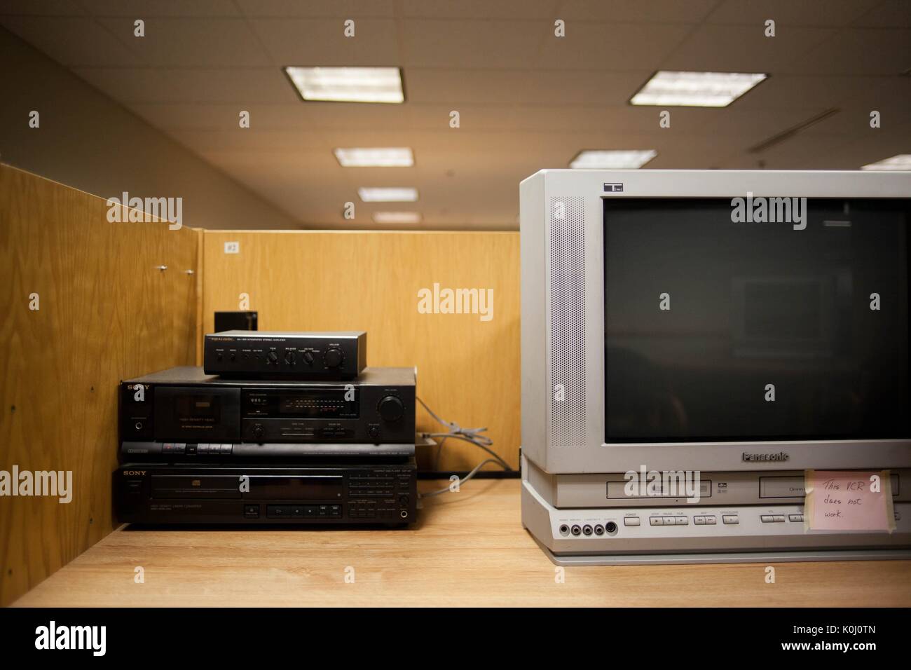 An outdated VCR system connected to a boxy television on a table, 2016. Courtesy Eric Chen. Stock Photo