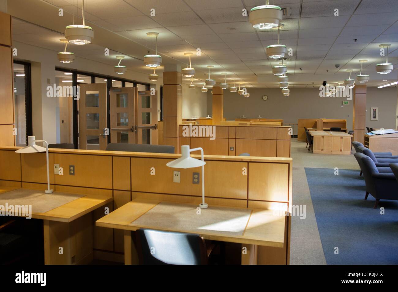 Photograph of the second level, M level, of the Milton S. Eisenhower library, depicting empty study cartels with morning light shining down, 2016. Courtesy Eric Chen. Stock Photo