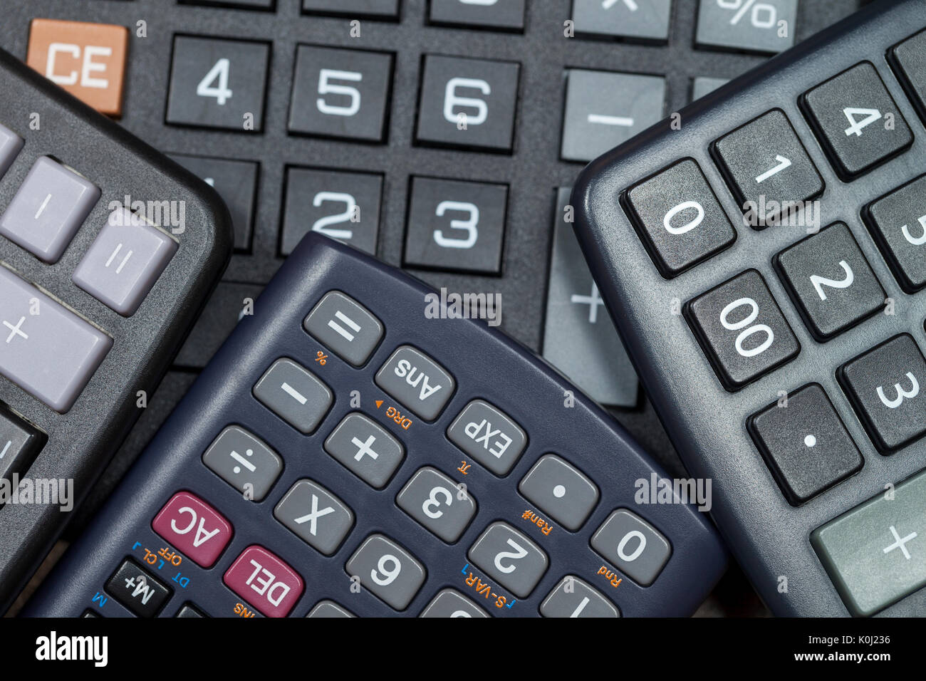 Close up shot of multiple calculator keypads stacked on each other Stock Photo