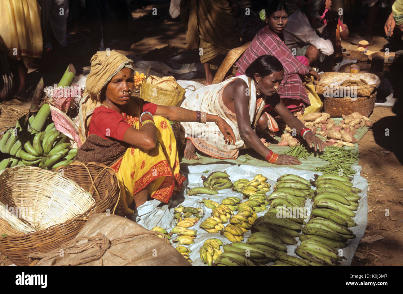 Produce vendors at weekly tribal market, Kunduli, Odisha (Orissa), India Stock Photo