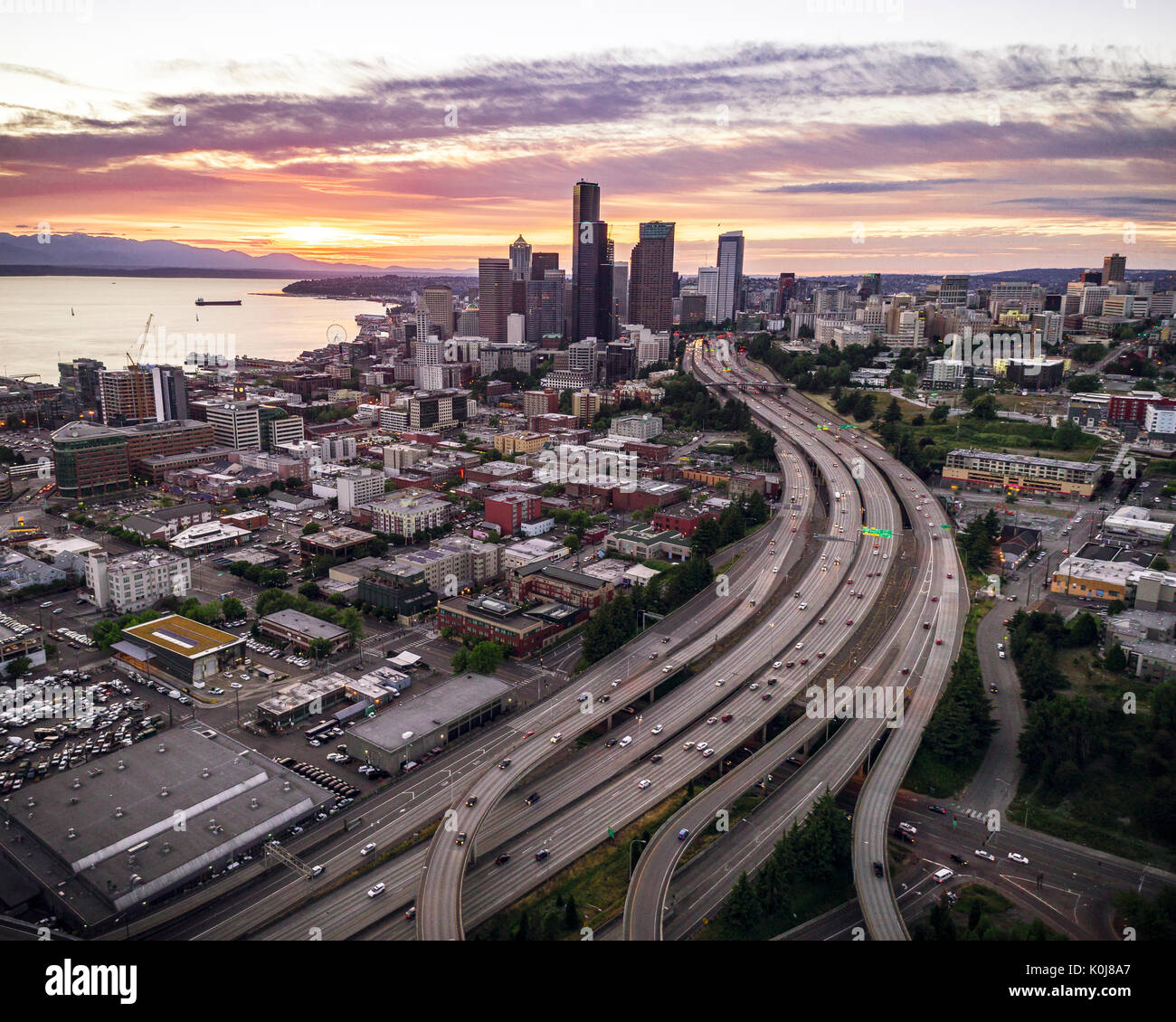 Coastal city in Pacific Northwest at dusk with pink and purple colors Stock Photo