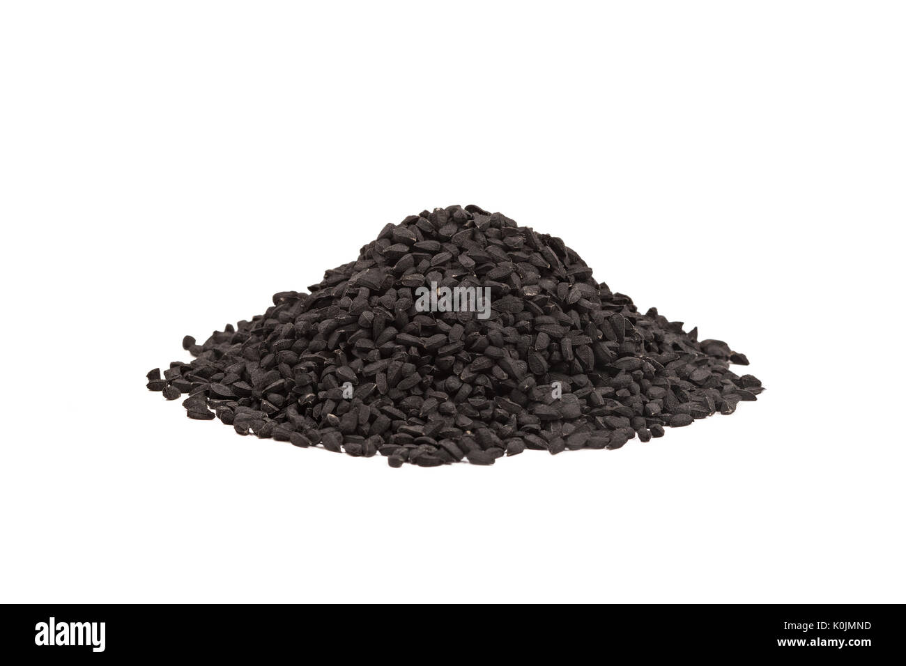 Black cumin seed in wooden scoop isolated on white background, Nigella sativa. Stock Photo