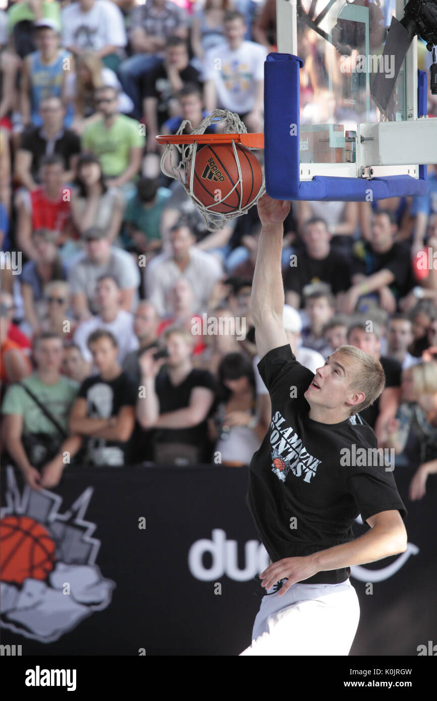 MOSCOW, RUSSIA - JULY 28: Latvian Kristaps Dargais take the second place in slam dunk contest during International Street Basketball Cup "Moscow Open" Stock Photo