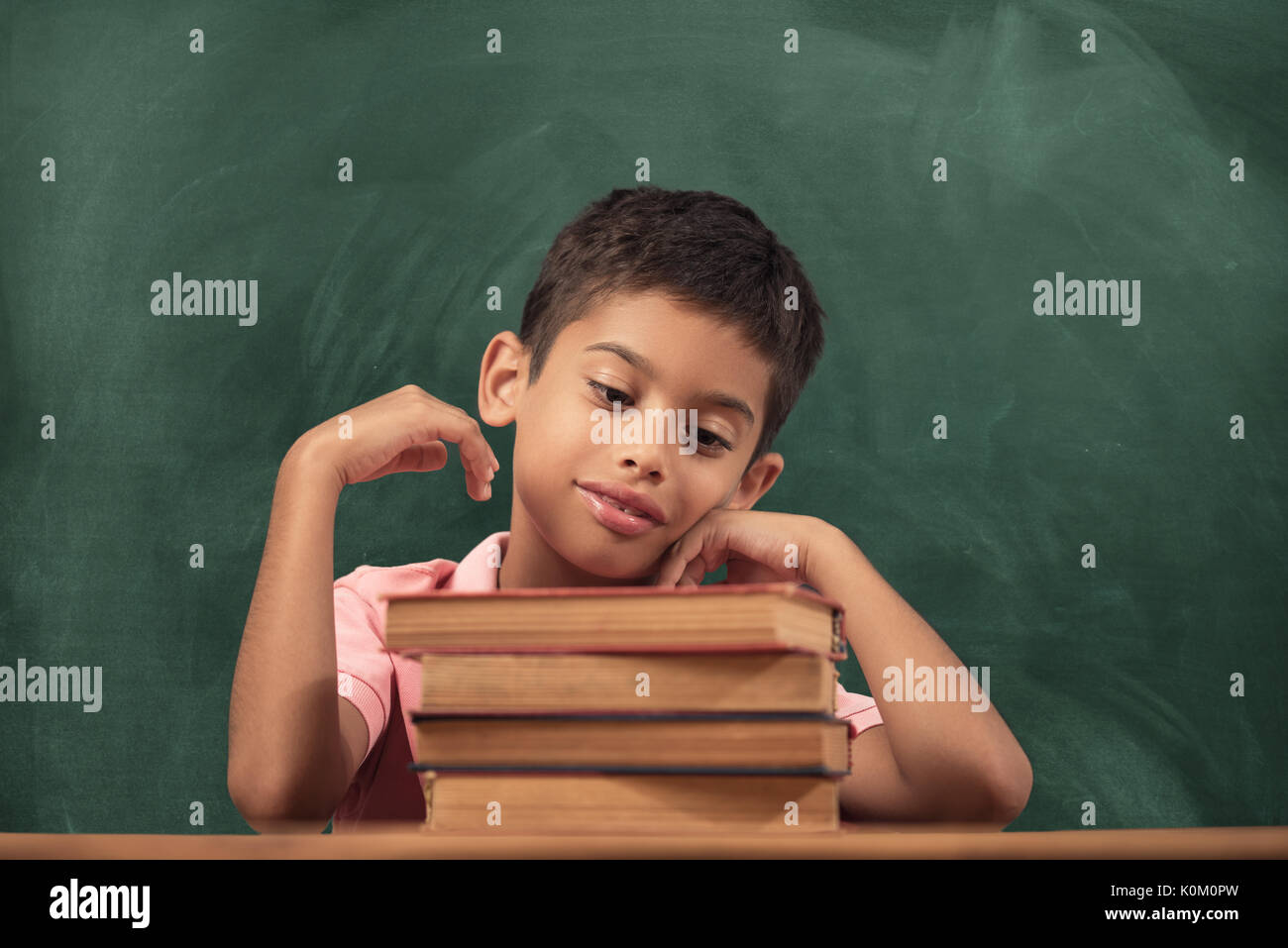 School Child Education Book on Blackboard Background Stock Photo