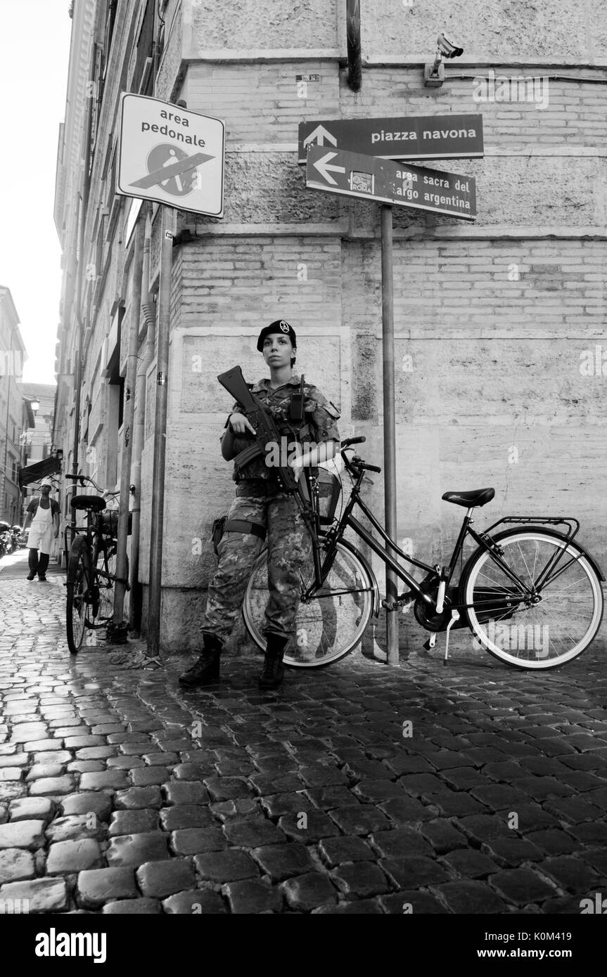 Female Italian Soldier in Rome on guard in the city. Stock Photo