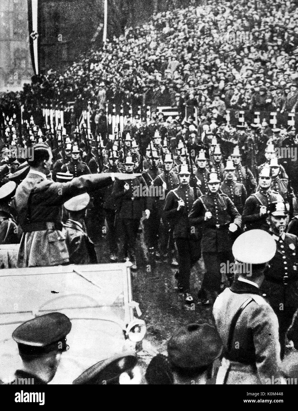 1935 Adolph Hitler of Germany salutes marching troops after the Saar plebiscite voted for the territory to return to become part of Germany. Stock Photo