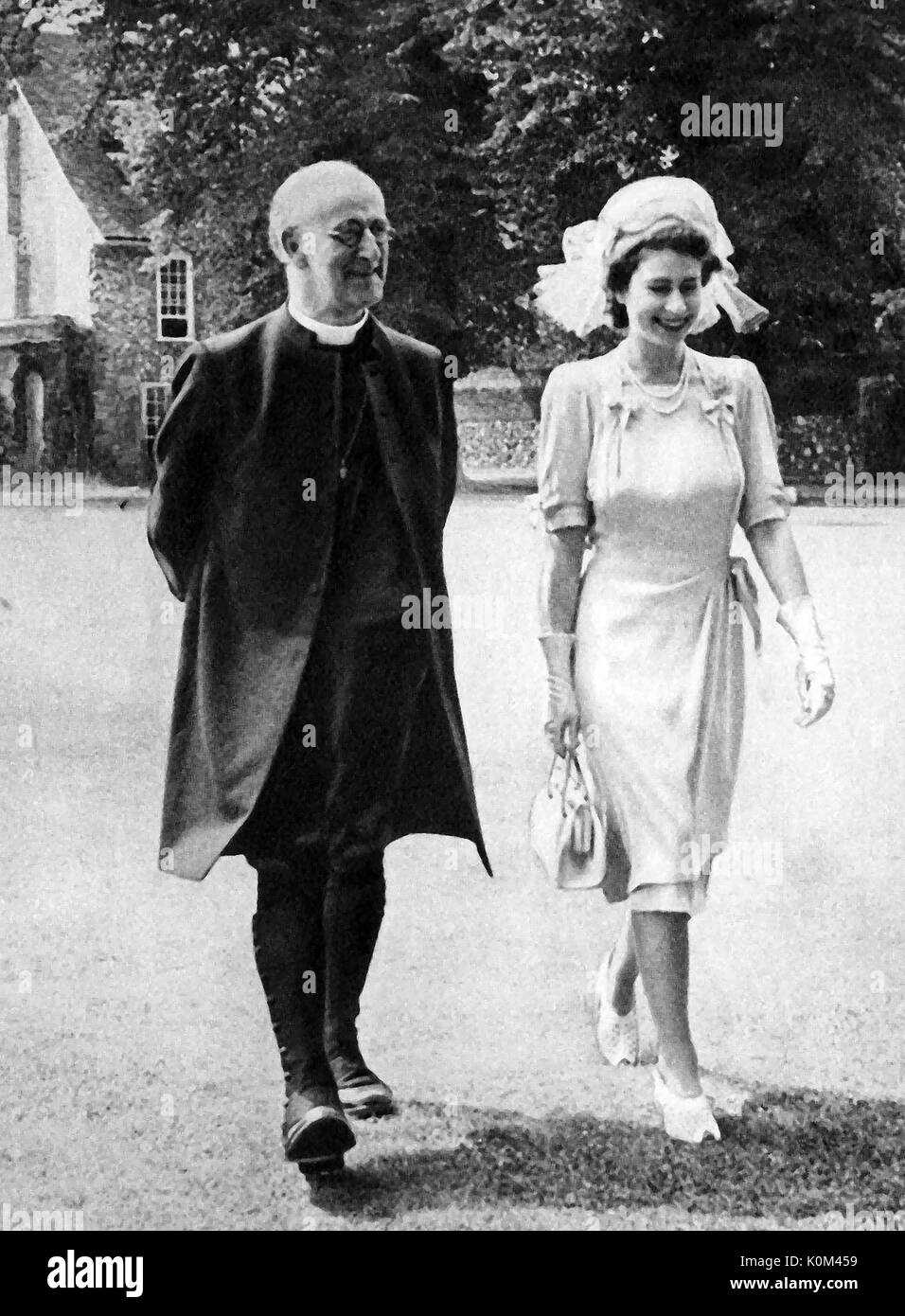 1947 Princess Elizabeth of Britain (later Queen Elizabeth the 2nd of Britain), walking in the precincts of Canterbury Cathedral with  the Archbishop of Canterbury Geoffrey Fisher (Lord Fisher of  Lambeth. Stock Photo