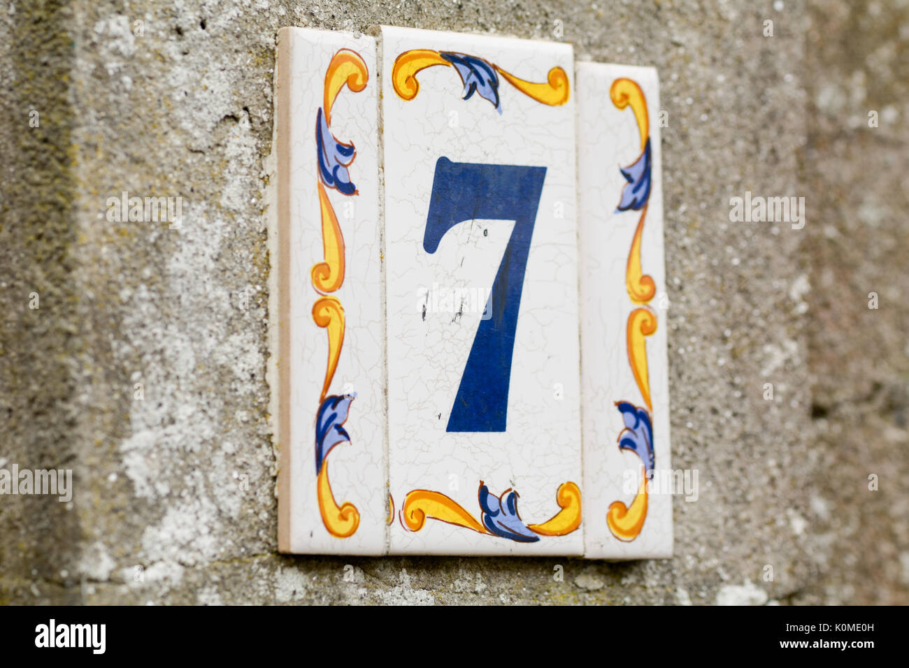 House number 7 sign on ceramic tile Stock Photo