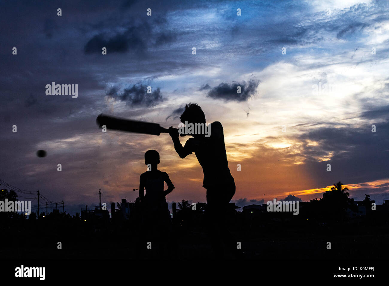 Boys playing cricket, Kolkata, West Bengal, India, Asia Stock Photo