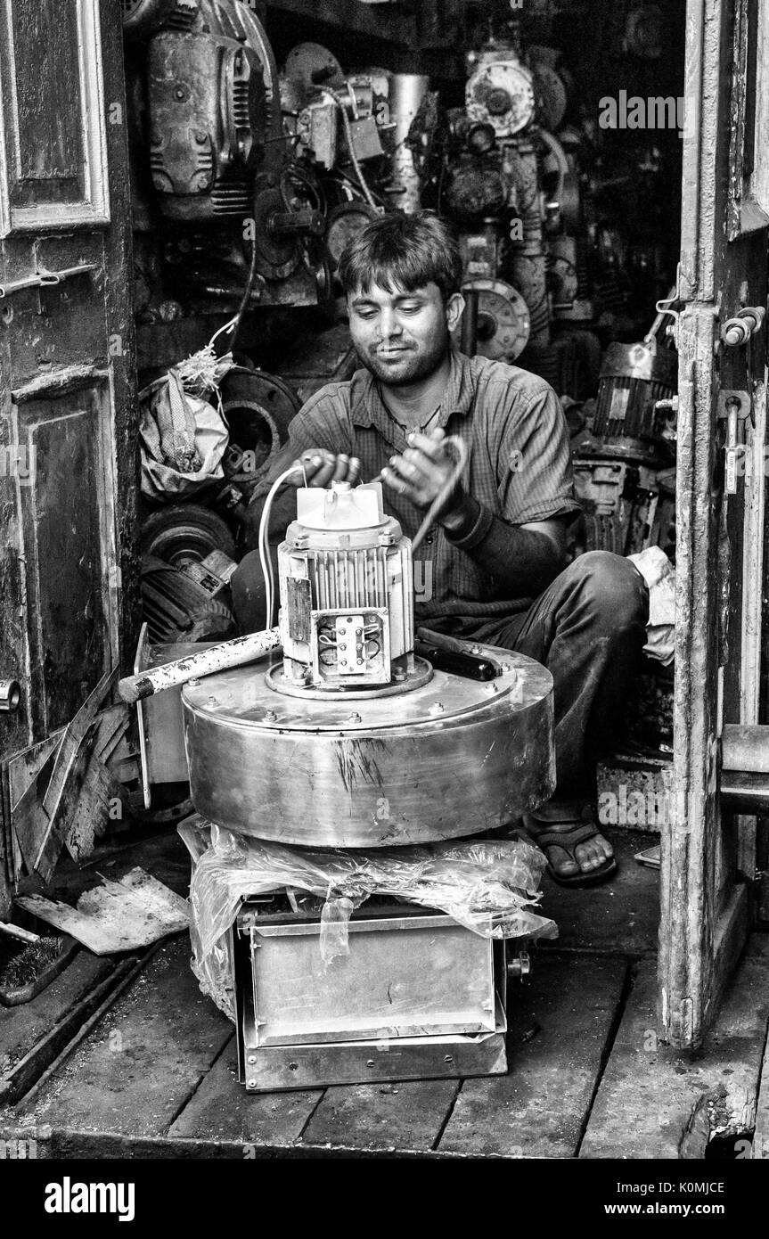 Man repairing motor, Chor Bazaar, Mumbai, Maharashtra, India, Asia Stock Photo